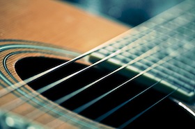 Close-up of an acoustic guitar's soundhole.