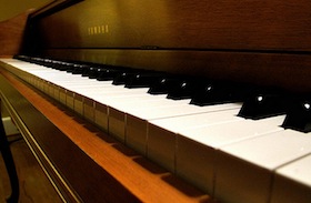 Close-up of a Yamaha piano's keyboard.